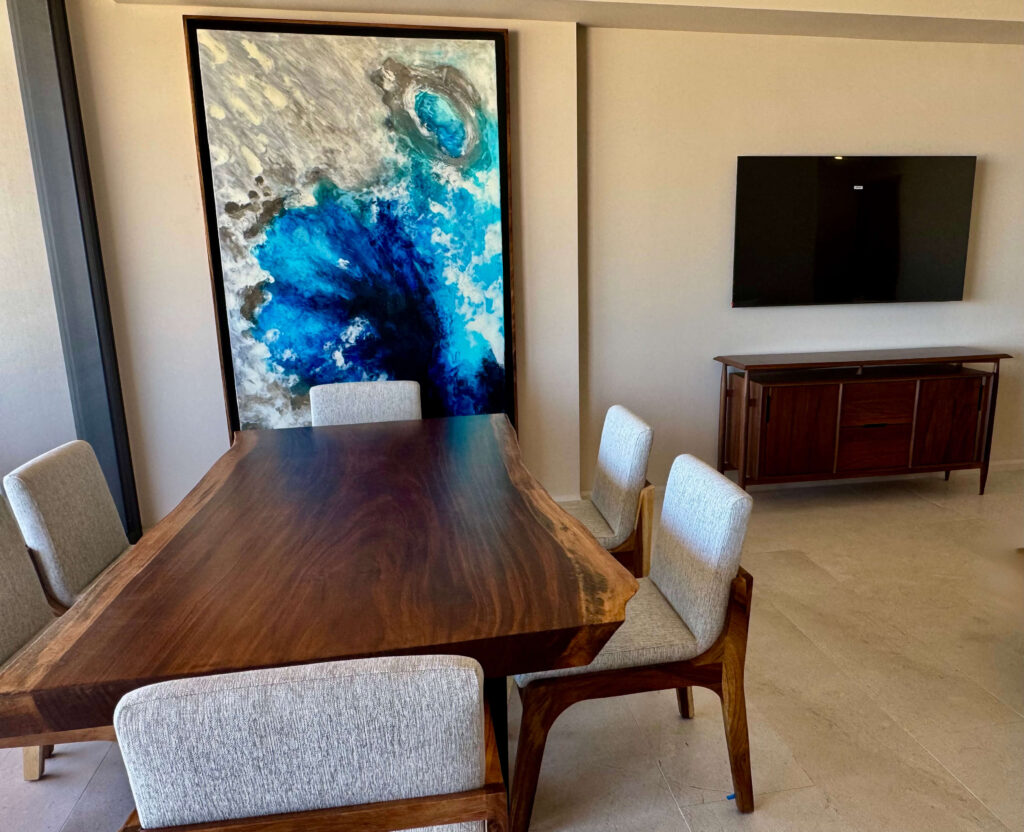 Cabo living room with live edge parota table, upholstered chairs, credenza