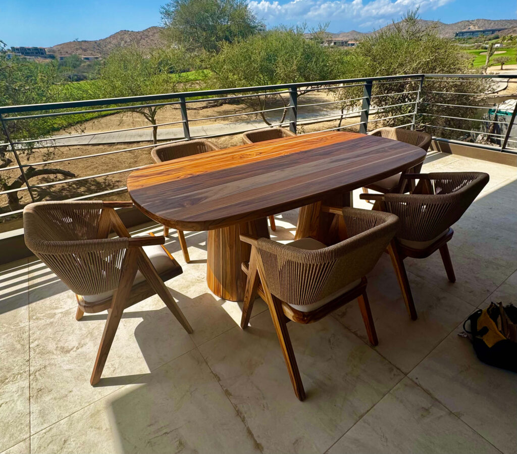Solid teak outdoor dining table with six rope dining chairs on Cabo terrace